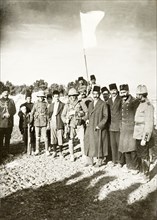 Under a white flag. Salim al-Husseini (5th from right with stick), Mayor of Jerusalem, surrenders