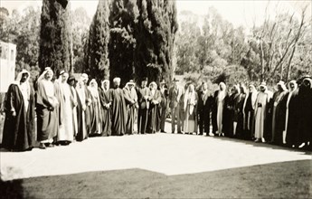 Group portrait of British and Arab officials. A number of British and Arab officials line up for a