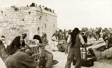 Preparing for a journey to Al-Masfara. A party of travellers prepares to embark on a journey to