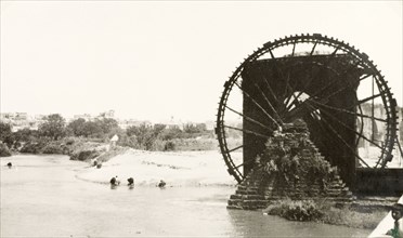 Noria on the Orontes River, Hamah. A huge noria (water wheel) lifts water from the River Orontes