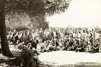 Arab mukhtars at a District Commissioner's party. A large group of Arab mukhtars (headmen) pose for