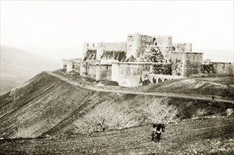 The Krak de Chevaliers. View of the Krak de Chevaliers, located atop a hill in the Homs Gap. Once