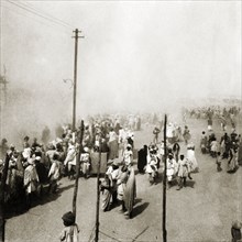 Pilgrims at the Ardh Kumbh Mela. Crowds of Hindu pilgrims line a procession route at the Ardh Kumbh