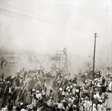 Procession at the Ardh Kumbh Mela. A procession passes through crowds of Hindu pilgrims on its way
