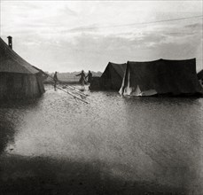 Flood at an Indian Police camp. Flooded tents at the camp of James Ferguson, Indian Police, sit in