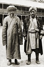 Kashmiri men from Srinagar. Full-length portrait of two Kashmiri men from Srinagar, dressed in