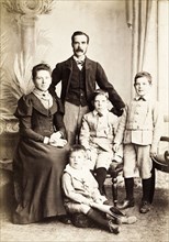 The Coton family. Studio portrait of the Coton family, dressed in typical late Victorian clothing.