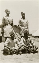 Arab soldiers with 'pagaris'. Portrait of four Arab soldiers at a military camp, wearing military