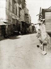 A back street in Suakin. A back street of Suakin. Several of the buildings on the left display