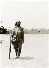 An askari of the King's African Rifles. Portrait of an armed askari (soldier) of the King's African