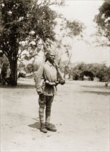 Portrait of an African schutztruppe. Portrait of an African schutztruppe, his rifle slung over his