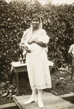 Indo-Trinidadian woman with baby. Portrait of an Indo-Trinidadian woman holding a baby in the crook