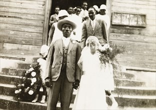 A newlywed Trinidadian couple. A newlywed Trinidadian couple descend the church steps after their