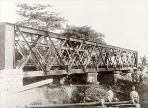 Building a railway bridge near the Caroni River. Construction workers build a 24-metre railway