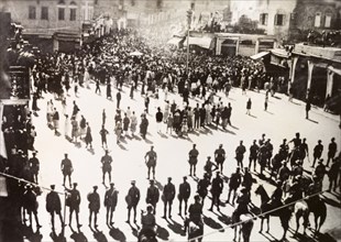 Troubles at Jaffa', 1938. British troops line a town square in Jaffa as an angry procession of