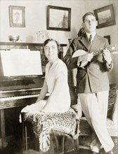 A musical family, Eastbourne. James Murray plays a banjo whilst his sister sits at the piano in the