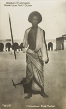 Portrait of a Hadadaoui man. Full-length portrait of a Hadadaoui man, standing barefoot in a