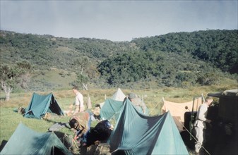 Camp at Mount Elgon roadhead'. Members of the Uganda Mountain Club set up camp on an expedition to