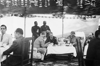 Taking tea with Sir Maurice Hallett. Reception at Jansath near Muzzaffarnagar. Seated centre left