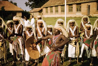 Banyaruanda dance in ceremonial dress. A group of Banyaruanda men and boys dance in ceremonial