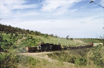 Construction train on the Western Ugandan Extension. Labourers going to work travelling on a