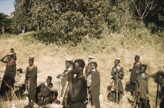 Porter's wives on a safari to Mount Napak. A group of porter's wives, wearing head pads and