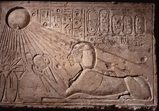 Relief depicting Akhenaten as a sphinx offering to the sun god Aten