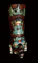 Turquoise mosaic encrusted wood mask representing either the rain god Tlaloc or Quetzalcoatl, the Feathered Serpent, in the form of the wind god Ehecatl
