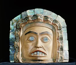 Chiefs frontlets with a human face surrounded by eleven smaller faces and an outer band of abalone shell