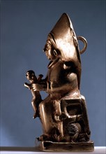 A pendant in the form of a seated goddess, probably representing the Sun Goddess of Arinna,Queen of the Land of Hatti, Queen of Heaven and Earth