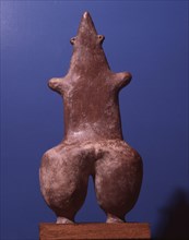 A mother goddess / fertility figure with emphasized hips and navel