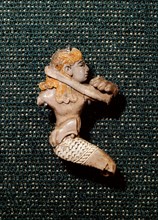 Ivory figure of Phoenician workmanship depicting a man fighting with a lion