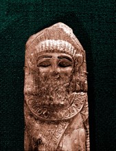 Fragment of a Phoenician   style ivory of a bearded head