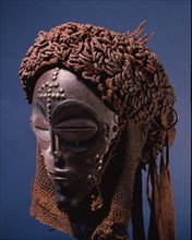 Dance mask of a type known as Mwana Pwo, regarded as an idealised depiction of a beautiful young girl