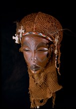 Dance mask of a type known as Mwana Pwo, regarded as an idealised depiction of a beautiful young girl, showing facial scarifications