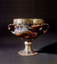 An onyx chalice richly decorated with silver gilt mounts, semi precious stones and enamels