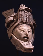 Pottery figurine with elaborate headdress