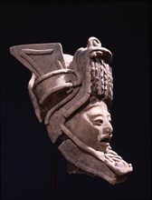 Pottery figurine with elaborate headdress