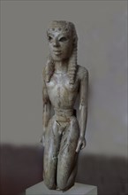 Ivory figurine of a kneeling youth used as a lyre support