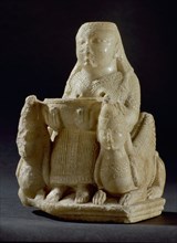Hollowed out figure of a female goddess of oriental origin, possibly associated with Astarte, seated on a throne like chair, flanked by two winged sphinxes