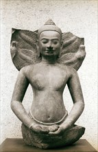 Bust of Buddha in meditation with a serpents hood behind him