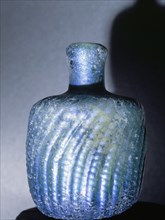 A bottle of iridescent glass