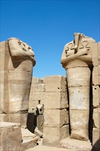 Two headless statues of a pharaoh