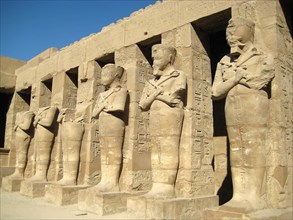 Temple of Ramses III, showing the mummy shaped sculptures of the pharaoh