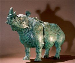 Rhinoceros shaped wine vessel (Zun) with a saddle on his back but missing his rider