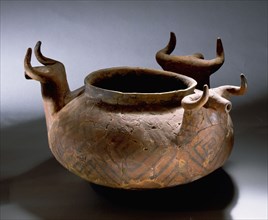 Vessel with zoomorphic handles and geometric decoration