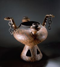 Vessel with anthropomorphic handles and geometric decoration