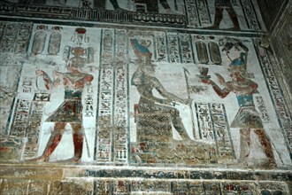 Painted relief carving from The Sanctuary of ritual offerings being made by the pharaoh to the goddess Hathor