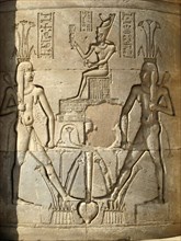 Carved relief on one of the cylindrical columns in the Hall of Appearance with depictions of the god Hapy, deification of the annual Nile floods