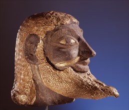 Etruscan head overlaid with gold
